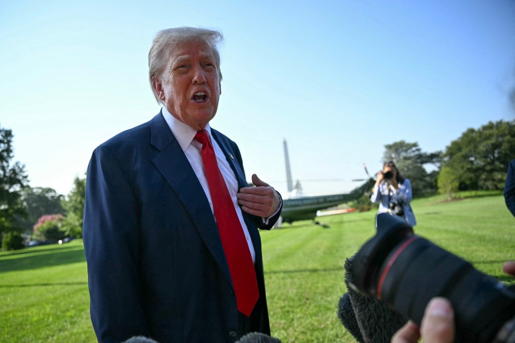 Donald Trump speaking to reporters on the White House lawn.