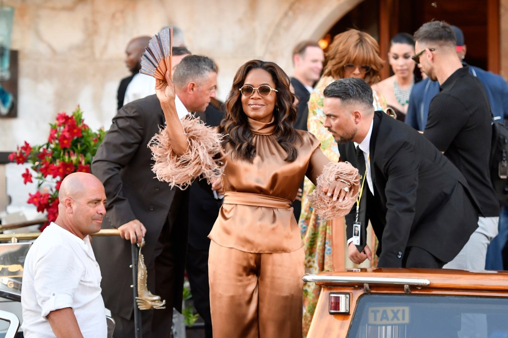 Oprah Winfrey leaves a hotel during celebrations for Jeff Bezos and Lauren Sanchez Bezos' wedding